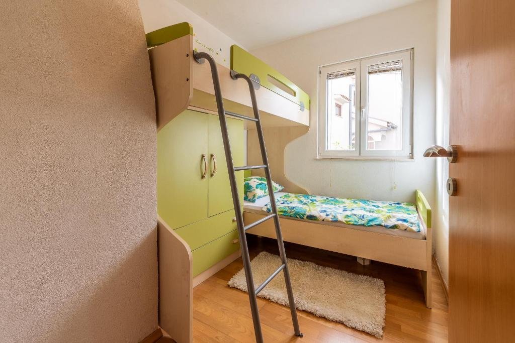 Room with a bunk bed and wardrobe